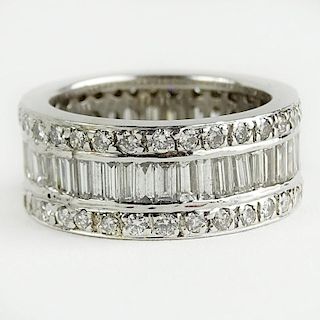 Lady's Approx. 3.0 Carat Round and Baguette Cut Diamond and 18 Karat White Gold Eternity Band.