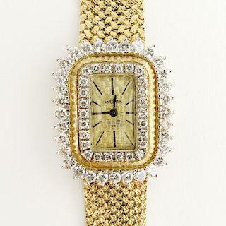 Lady's Vintage Angelus 14 Karat Yellow Gold Diamond Bezel Watch with 14 Karat Yellow Gold Band.