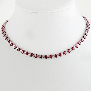 Lady's Approx. 38.0 Carat Oval Cut Ruby, 5.0 Carat Baguette Cut Diamond Gold Necklace.