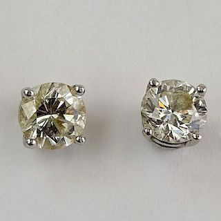 Pair of Lady's Approx. 1.90 Carat (.95 carat each) Total Weight Round Cut Diamond and 14 Karat White Gold Ear Studs. Diamonds I-J color, VS2 clarity. 