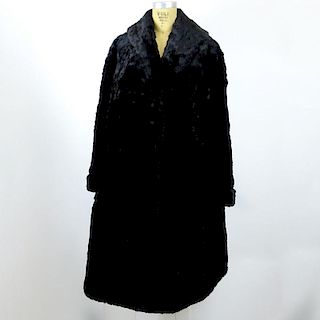 Antique Seal Fur Coat. Lined, Shawl collar and cuffs. Some separations in the pelts or in good condition. Measures 43" Length. Shipping $75.00