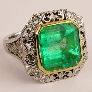 Lady's Approx. 10.80 Cut Emerald and 14 Karat White Gold Ring accented with Round Cut Diamonds.