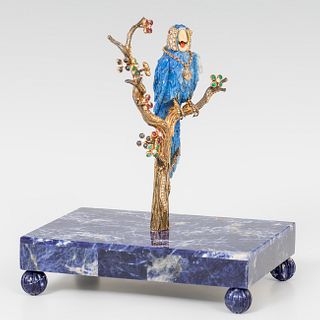 Magnificent sculpture of a lapis lazuli macaw with rhinestones and colored stones.