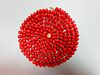 A long red coral bead necklace, the individually-knotted tyre shaped coral beads of approximately 8m