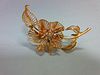 A mid-20th century diamond set flower brooch, of open wirework structure with three curled leaves an