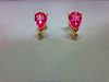 A pair of pink sapphire, diamond and 18ct gold earstuds, each post headed by a three claw set pear c