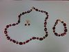 A ruby and pearl suite, the necklace and bracelet, which may be worn individually or continuously, c