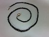 A black diamond bead necklace, the graduated 2.5 - 5.3mm diameter faceted black diamond beads, close