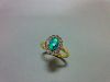 An oval opal and diamond cluster ring, the oval cabochon opal in a petal-edge border of single cut d
