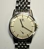 By Omega - a gentleman's steel cased manual wind wristwatch, circa 1960's, champagne coloured dial w