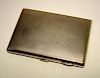 A 9ct gold pocket cigarette case, by S Blackensee & Co, Birmingham 1914, rectangular, engine turned,