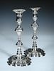 A pair of George III cast silver candlesticks, probably by John Horsley, London 1762, each raised fr