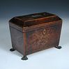 A George III burr elm tea caddy, the tapered body with boxwood stringing raised on lion paw feet 15