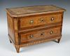A 19th century Milanese miniature walnut marquetry commode, the rectangular top with canted front co