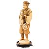 TRAVELING ACTOR, JAPAN, EARLY 20TH CENTURY, Ivory carving, sgraffito and inked. Includes wood base. Signed. 8.8" (22.5 cm) tall | ACTOR AMBULANTE JAPÓ