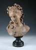 After Albert-Ernest Carrier-Belleuse, a terracotta bust of a young woman with roses in her hair, inc