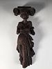 A 17th century oak term, carved as a lady in classical dress supporting an Ionic capital on her head