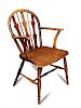 An early 19th century ash and fruitwood Windsor armchair, with fret carved and stick back, on turned