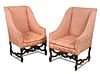 A pair of 17th century oak framed wing back armchairs, in the Dutch manner, upholstered in a pink da