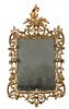 An 18th century carved giltwood framed wall mirror, bevelled mirror plate, regilded carved frame in