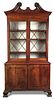 An early George III mahogany cabinet, with swan neck pediment above two glazed doors and panelled do