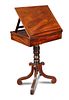 A Regency mahogany reading table, with adjustable slope, fitted end drawer for ink wells and pens, o