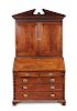 A George III mahogany bureau bookcase, circa 1770 with breakarch pediment, dentil cornice with blind