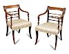 A Pair Regency mahogany bar back elbow dining chairs, with ebony line inlays, the reeded arms on vas