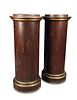 A pair of faux porphyry pedestal columns, with moulded gilt edged capitals and plinth bases (2) 126