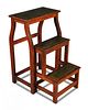 A set of oak folding library steps, with leather lined treads 71 x 44 x 30cm (28 x 17 x 12in) <br. <