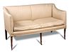 A Regency square back sofa, with loose cushion seat, on six ring turned front legs and casters 90 x