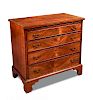 A George III mahogany chest of drawers, with chequered line inlaid decoration, brushing slide and fo