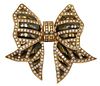 18 Karat Gold Bow Brooch, having enameling set with 202 round cut diamonds, height 2 1/2 inches, width 2 3/4 inches, 44.9 grams.