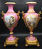 Pair of Large Pink Porcelain French Urns, Sevres style, having gilt bronze mounts with painted classical panels and gold foliate decoration, on square