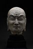 A CHINESE TANG DYNASTY GREY LIMESTONE LUOHAN HEAD