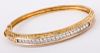 A 14K Yellow Gold and Diamond Bangle Bracelet