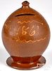 Pennsylvania ovoid redware bank, dated 1861