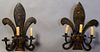 Pair of French Steel Fleur-de-Lis Three Light Sconces, 20th c., the back plates issuing three curved candle arms, having been surface wired for electr