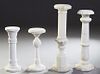 Group of Four Carved Alabaster Pedestals, 20th c., consisting of two tall examples with circular tops and reeded sides to hexagonal bases; two short e