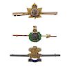 A selection of five military brooches. To include an enamel Royal marines bar brooch, a Royal welsh