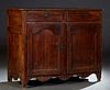 French Provincial Louis XV Style Carved Oak Sideboard, c. 1800, the stepped rounded corner top over two frieze drawers and double cupboard doors with 