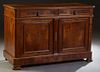 French Louis Philippe Carved Walnut Sideboard, 19th c., the canted corner ogee edge top above two frieze drawers over setback double paneled doors, fl