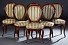Set of Six French Louis XV Style Carved Mahogany Dining Chairs, 19th c., the canted oval cushioned back above a bowfront cushion seat, on cabriole leg