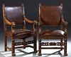 Pair of French Provincial Carved Oak Fauteuils, c. 1880, rectangular back to curved arms with lions head terminals, to an upholstered seat, on lion, f