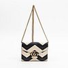 Gucci Matelasse GG Marmont Chain Wallet, in black and ivory calf skin with chevron stitching design and golden brass hardware, opening to a black leat