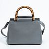 Gucci Nymphaea Bamboo Bag, in grey smooth calfskin leather with golden hardware, opening to a matching grey leather and baby pink suede lined interior