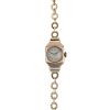 A ladies mid 20th century 9ct gold manual wind bracelet watch. The circular-shape Arabic dial, withi