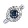 A 14ct gold treated diamond and diamond cluster ring. The treated blue brilliant-cut diamond, within