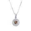 An 18ct gold coloured diamond and diamond cluster pendant. The brilliant-cut 'brown' diamond, within