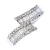 (187921) A diamond crossover ring. Designed as two rows of baguette-cut diamonds within a channel of